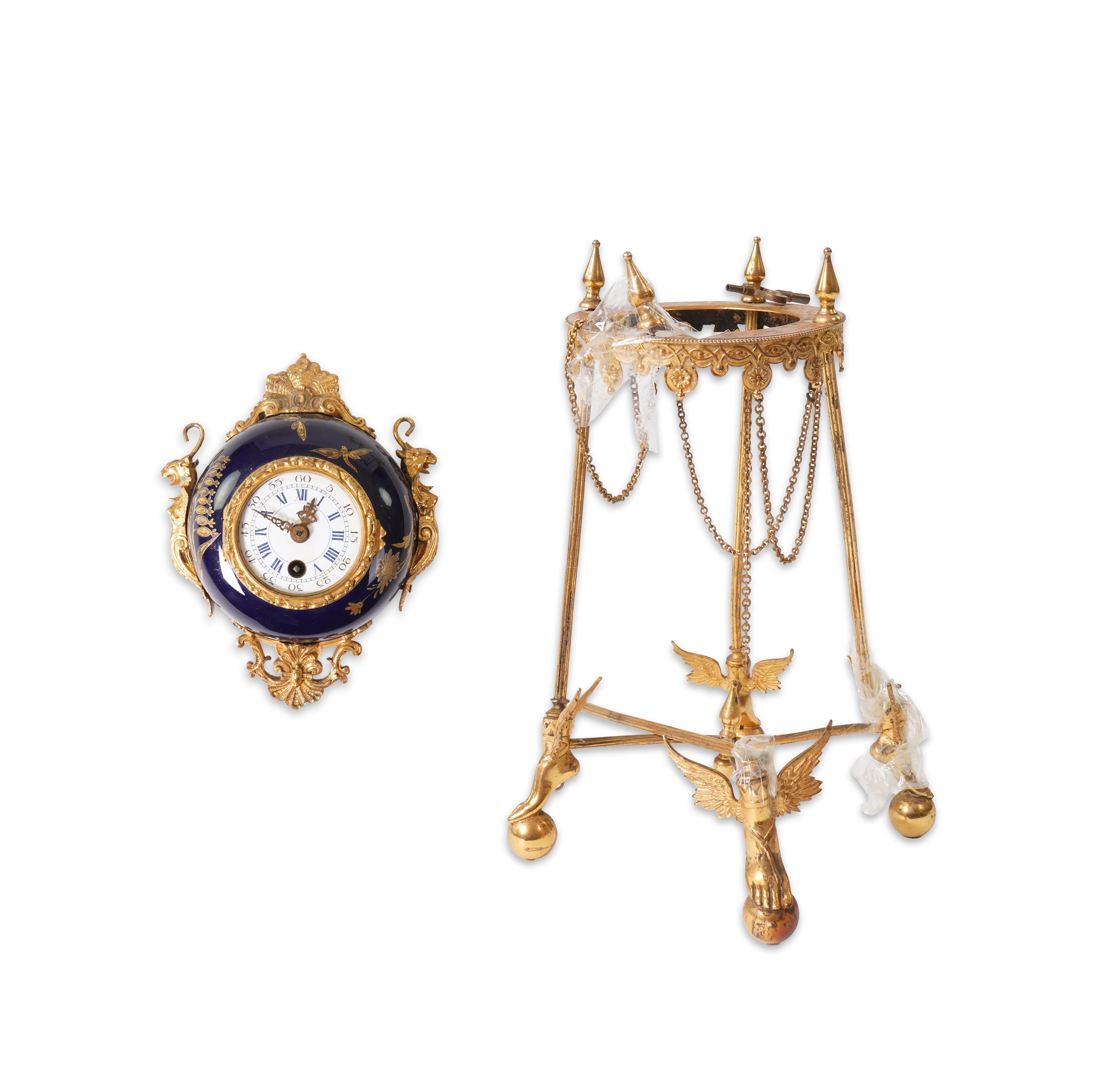 An unusual enamel and gilt brass timepiece, pendant from gilt brass frame, stand 26cm high. Condition - dismantled